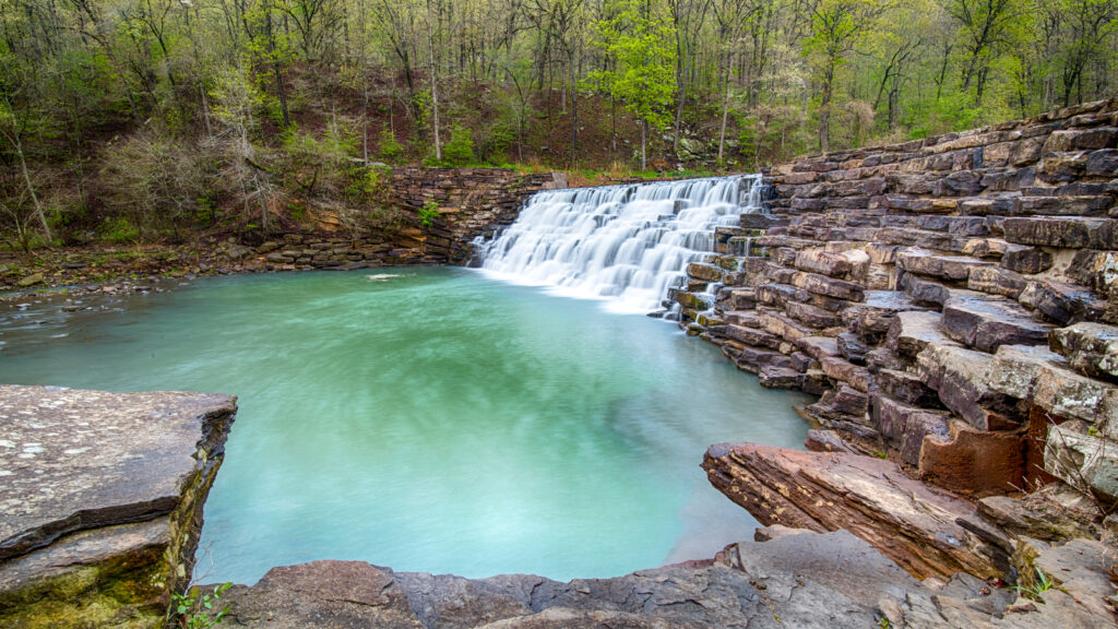 Lee Creek spills across Lee Creek Dam, at Devil's Den State Park, in Arkansas.