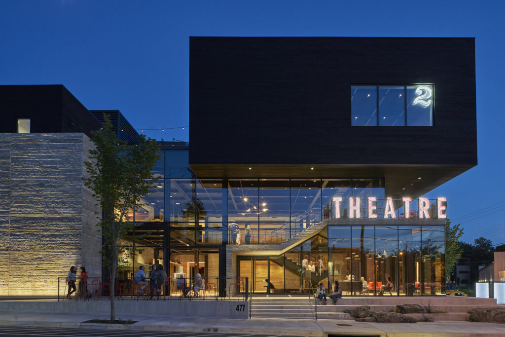 TheatreSquared Building lit up at dusk