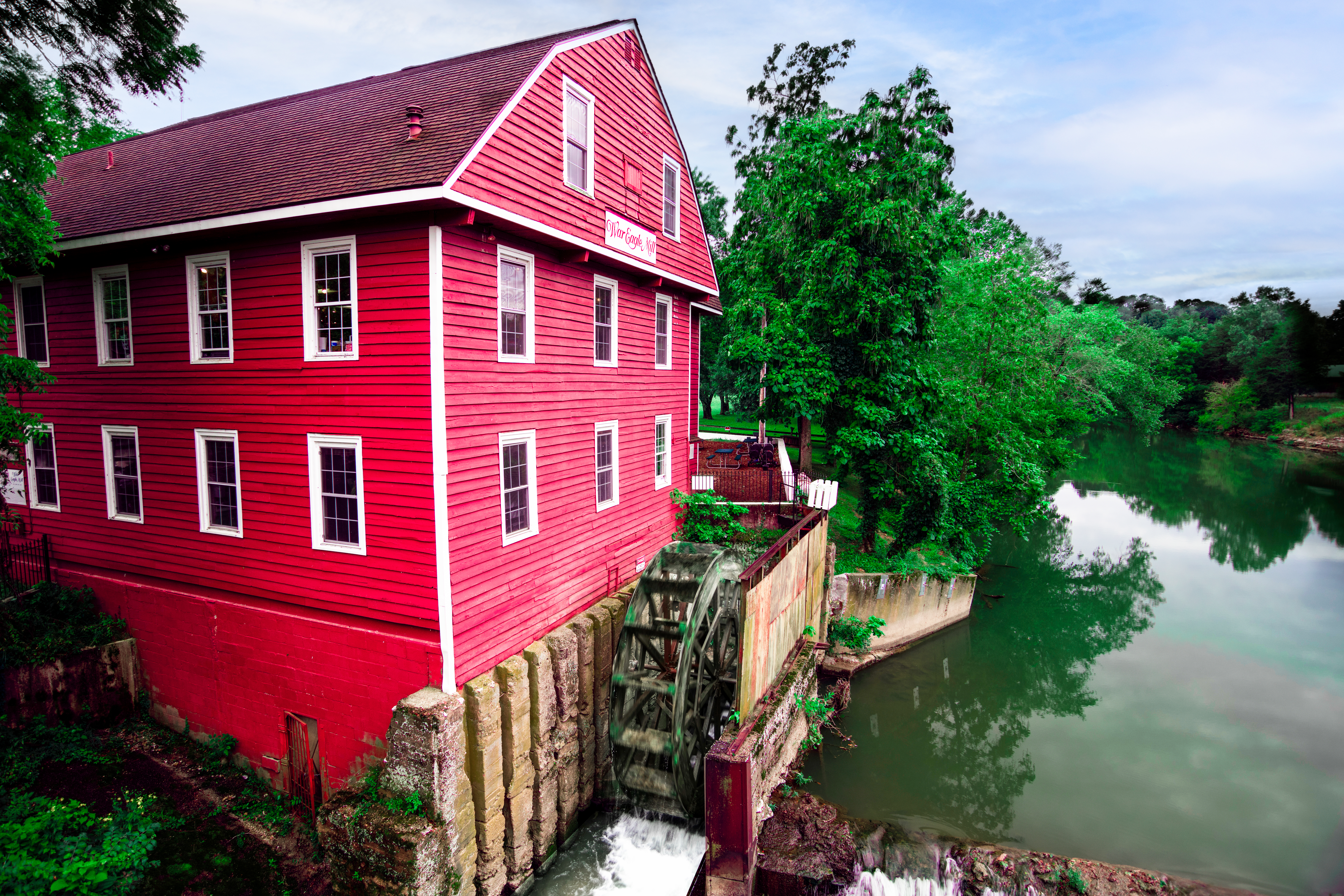 Historic War Eagle Mill on War Eagle River on cloudy morning