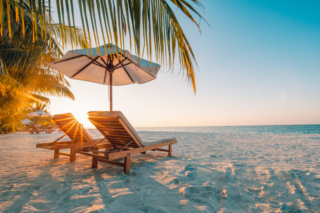 Beautiful beach. Chairs on the sandy beach near the sea. Summer holiday and vacation concept for tourism. Inspirational tropical landscape