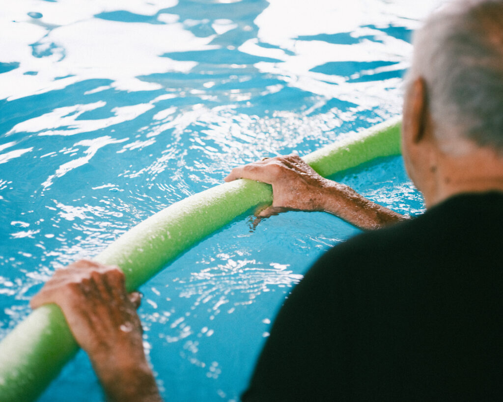 A man exercises in the pool at Grand Village, an independent living retirement community in Fayetteville, Arkansas.