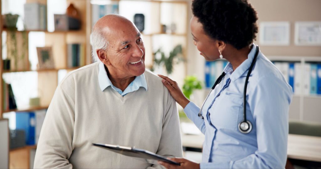 An older man consults with a physician about his health.