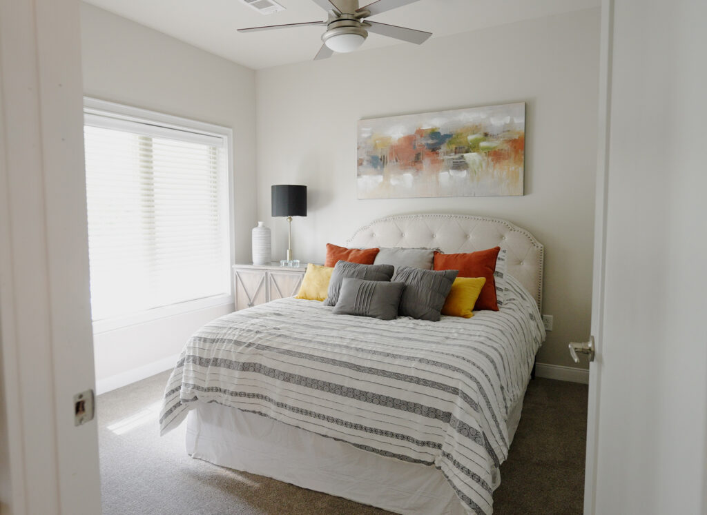 A well-appointed, comfortable, welcoming bedroom in an independent living community.