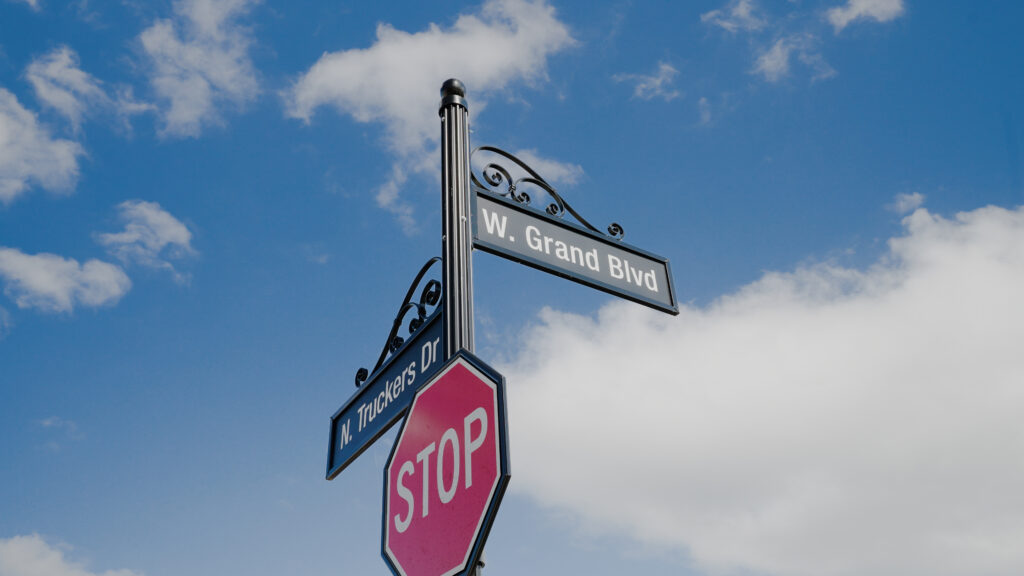 A street sign reads "Grand Blvd." - the entrance to Grand Village at Clear Creek, a luxury independent living community in Fayetteville, Ar for retirees 55 and older.